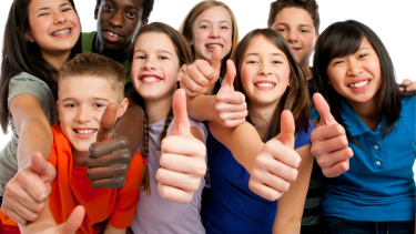 Group of diverse youth with thumbs up