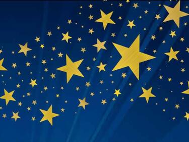 Blue background, yellow stars in a variety of sizes