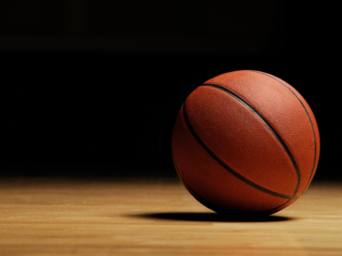 Basketball on gym floor