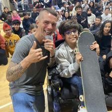 Dave Jonsson with student winning skateboard